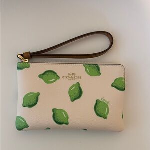 Coach Beige Wristlet with Green Lemon Design